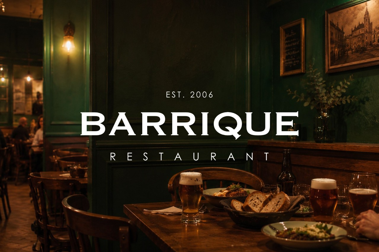 The BARRIQUE Žilina restaurant interior with the logo, beer and bread on the table